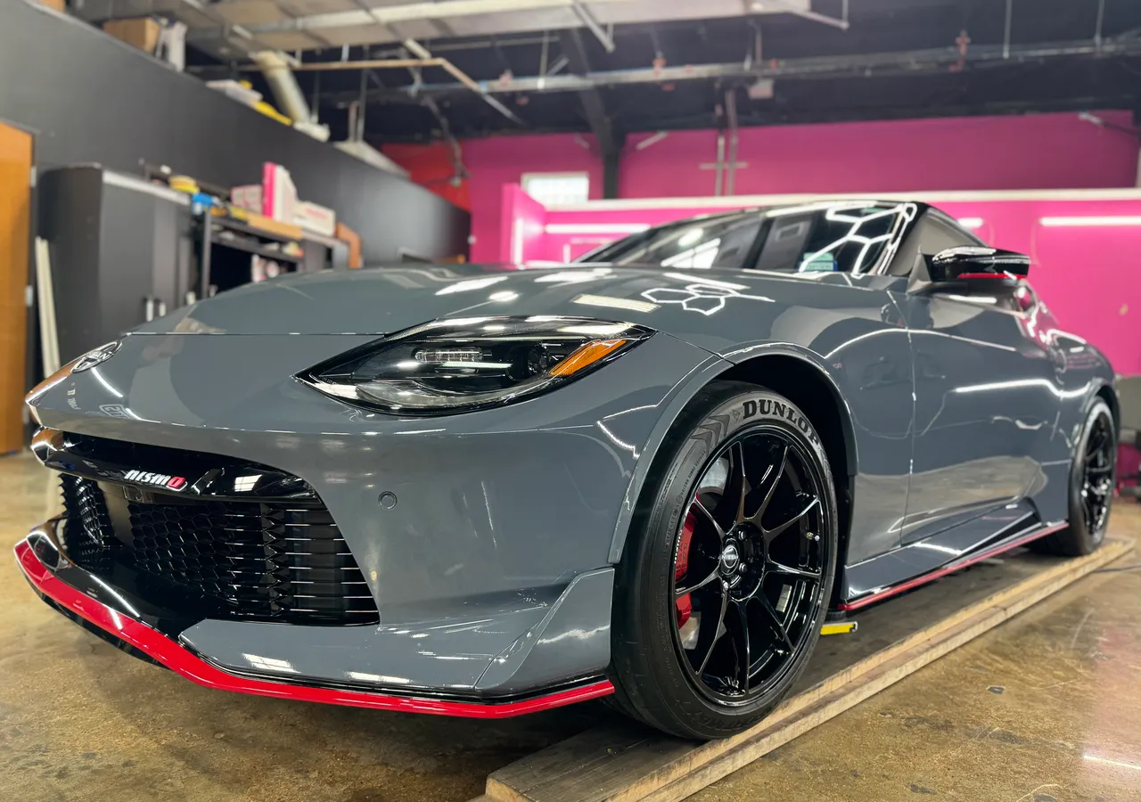 Grey sports coupe under paint protection film at Protektd Detailing, Dallas