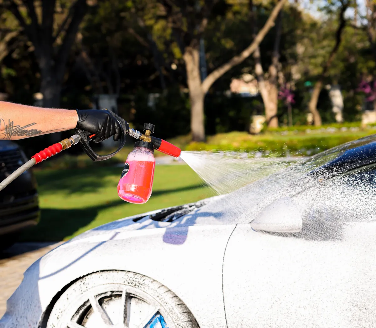 Black Bugatti Chiron during a careful foam wash — Protektd Detailing, Dallas