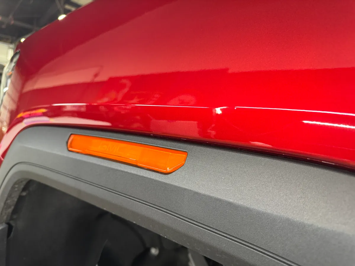 Rear quarter of a red Dodge Challenger with corrected paintwork — Protektd Detailing, Dallas
